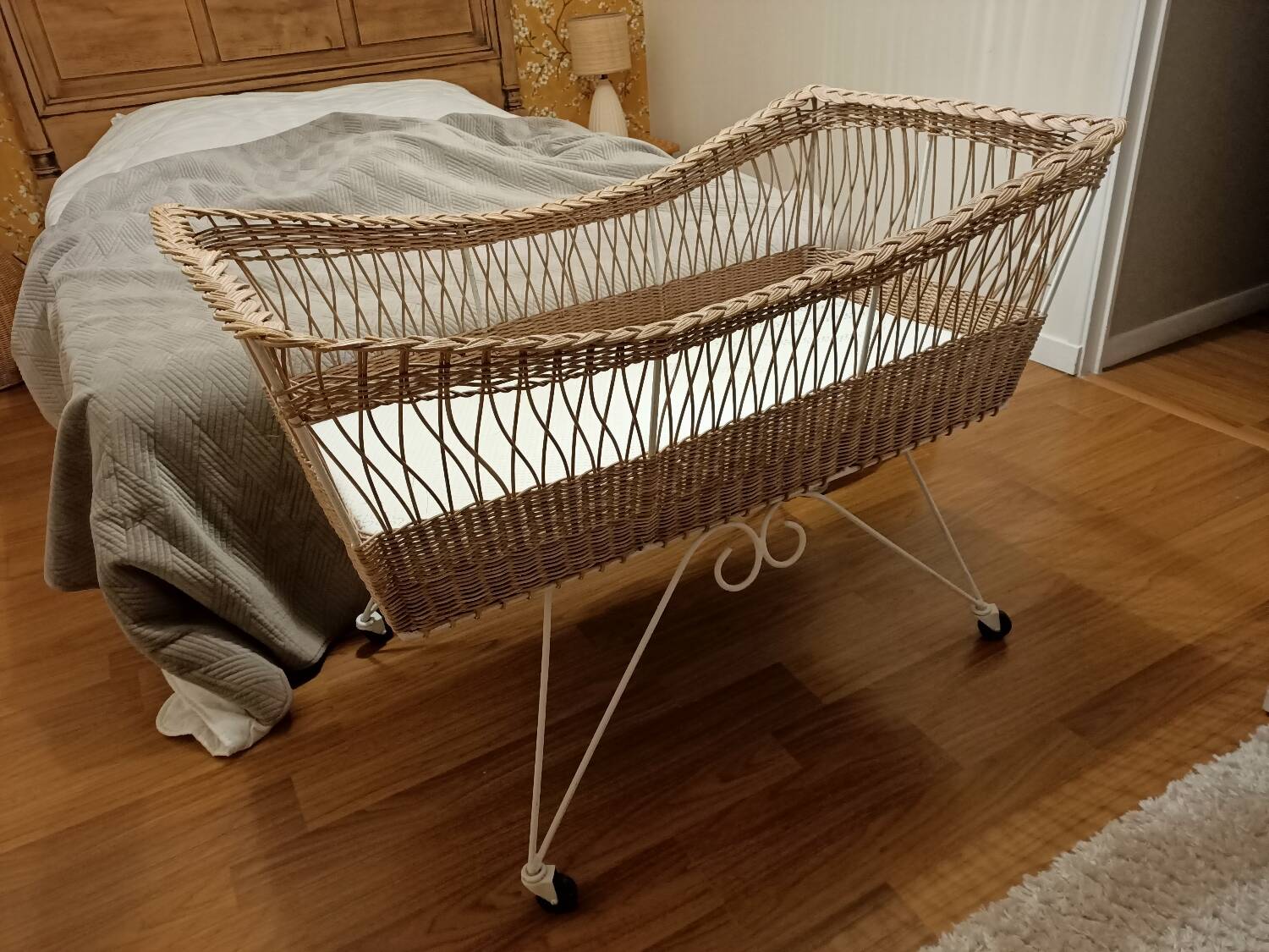 Rattan and wrought iron cradle