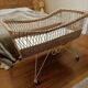Rattan and wrought iron cradle