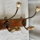 19th-century wall coat rack with 2 metal and horn hooks.