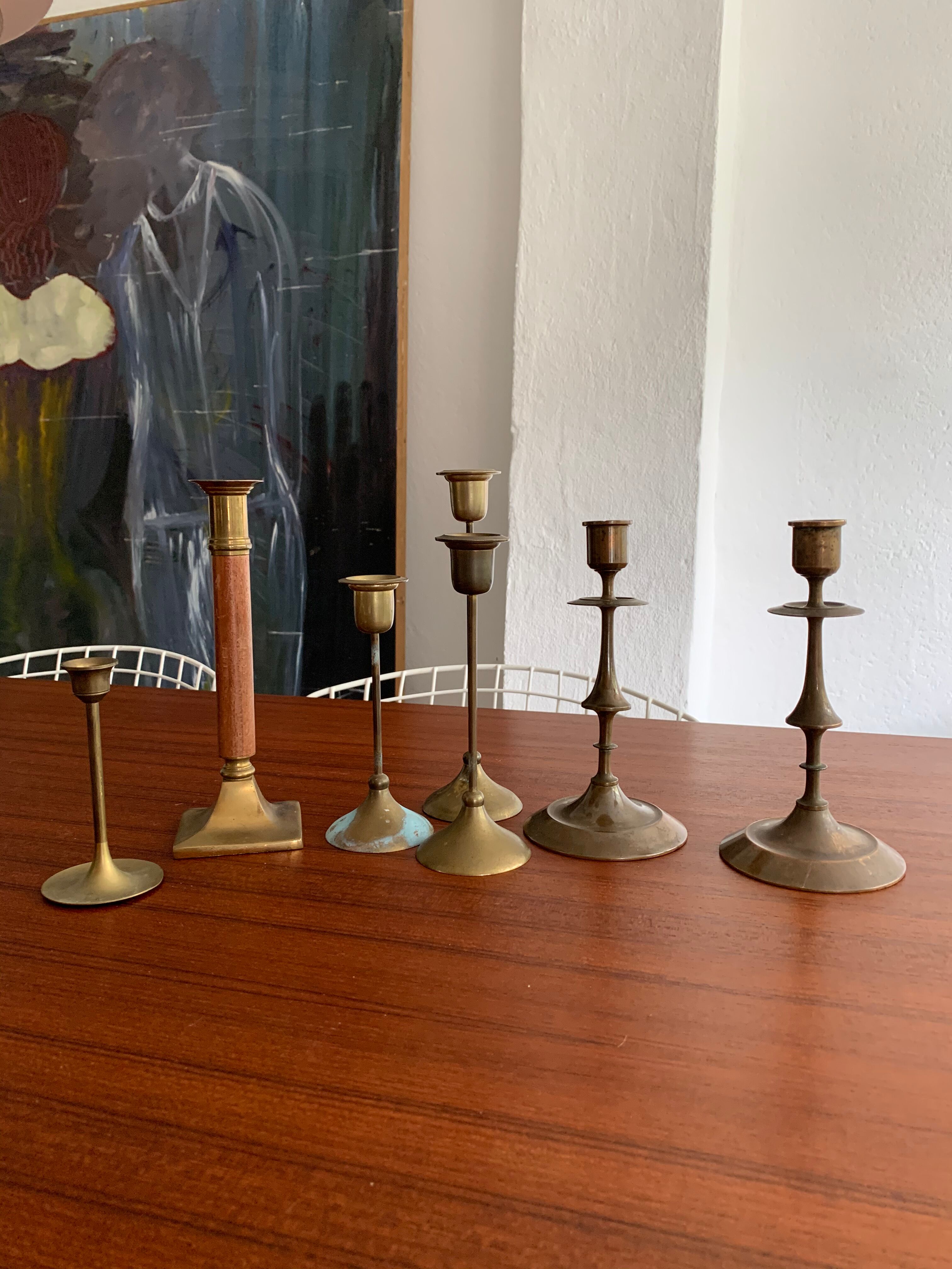 Set 7 mismatched brass and bronze candlesticks