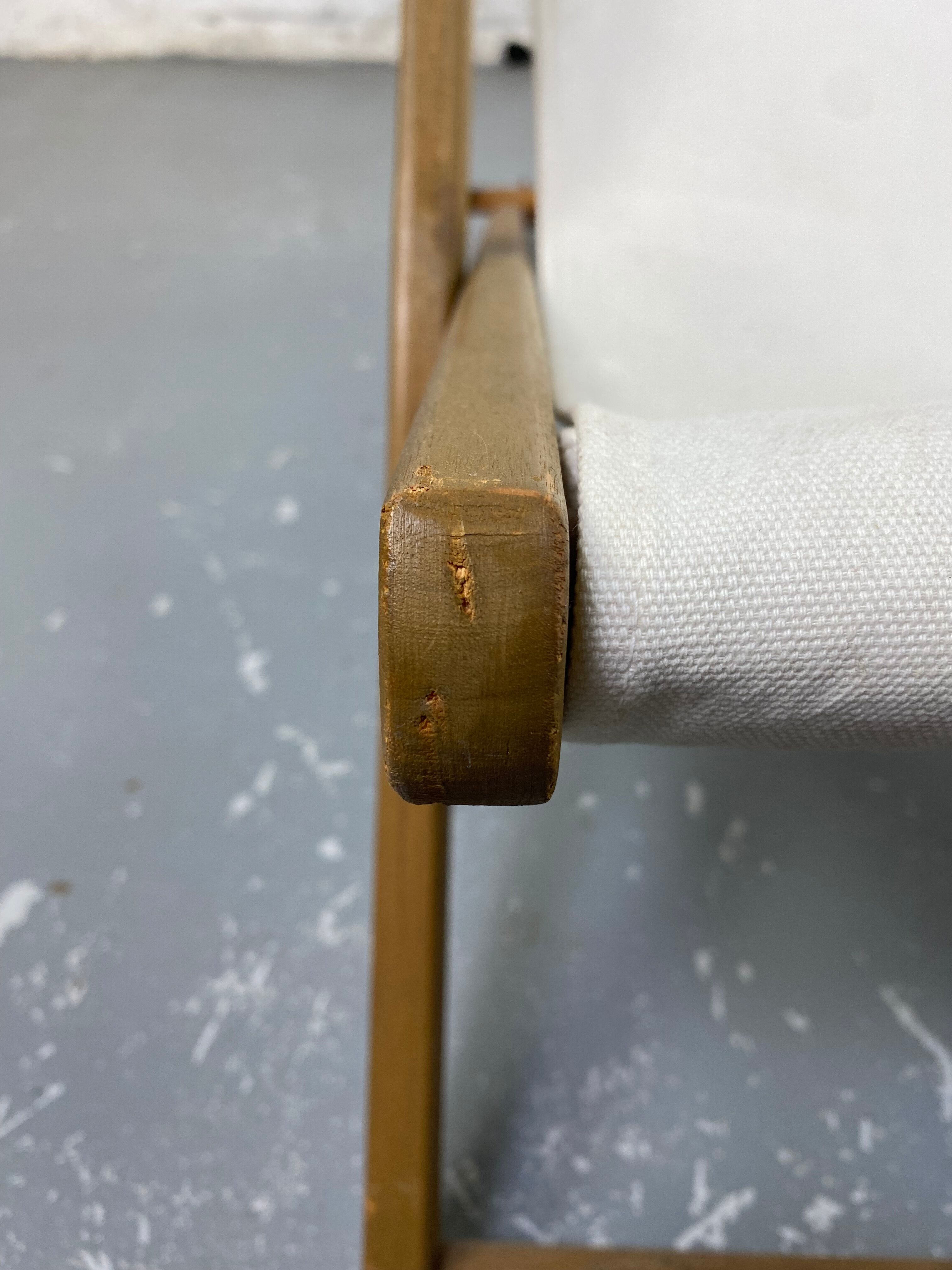 White fabric deckchair with wooden structure