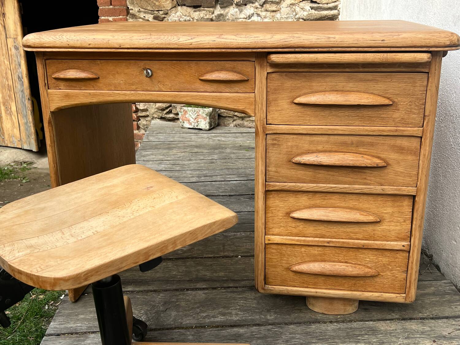 Antique light oak desk from the 1950s with 4 drawers