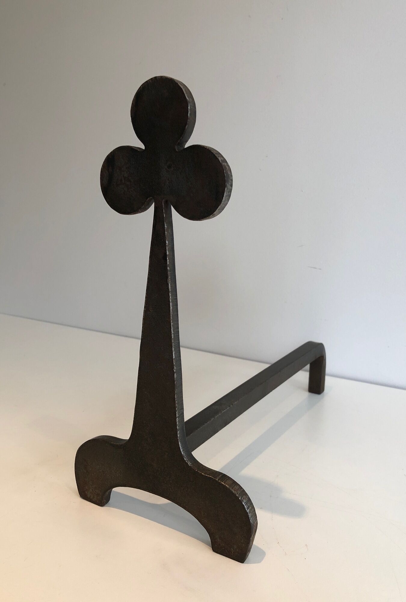 Pair of wrought steel and iron chenets with clover decorations 1950