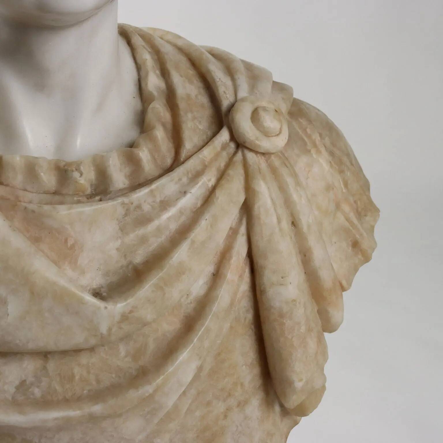 Bust of a Roman emperor in white marble, Italy, 20th century.