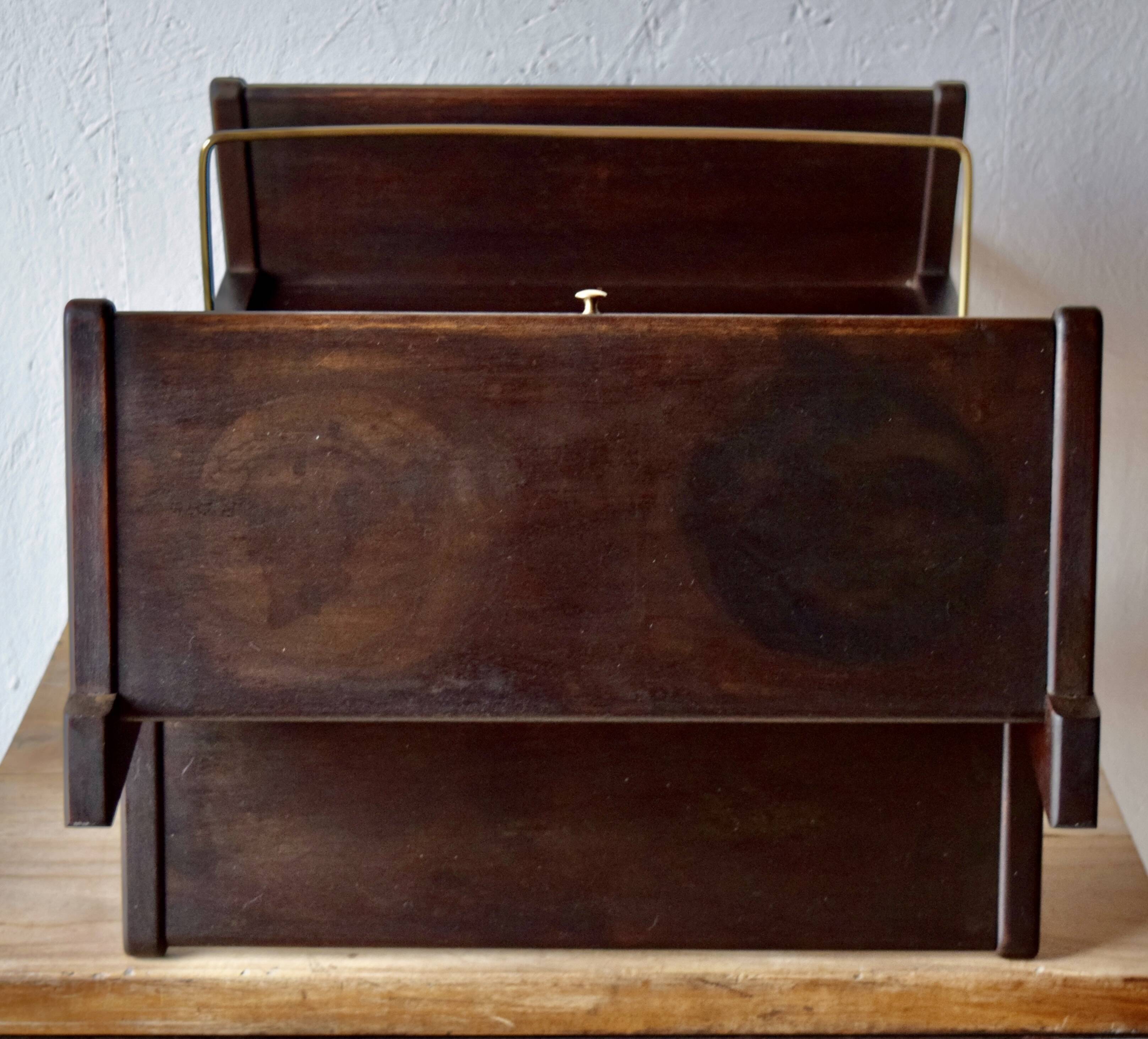 Old Scandinavian style magazine rack in dark wood with integrated brass ashtray