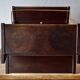 Old Scandinavian style magazine rack in dark wood with integrated brass ashtray