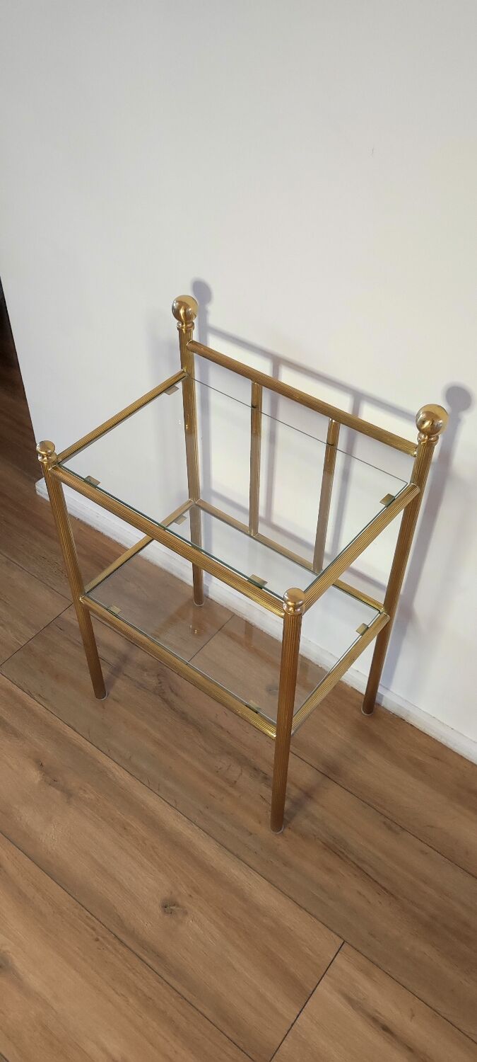 Bedside table in brass and glass.