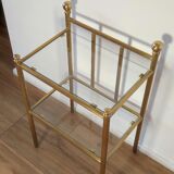 Bedside table in brass and glass.