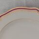 Set of 12 stylised white porcelain dinner plates, signed.
