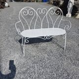 Old garden bench in solid wrought iron