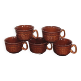 Caramel brown ceramic mugs with geometric flower pattern from the 70s
