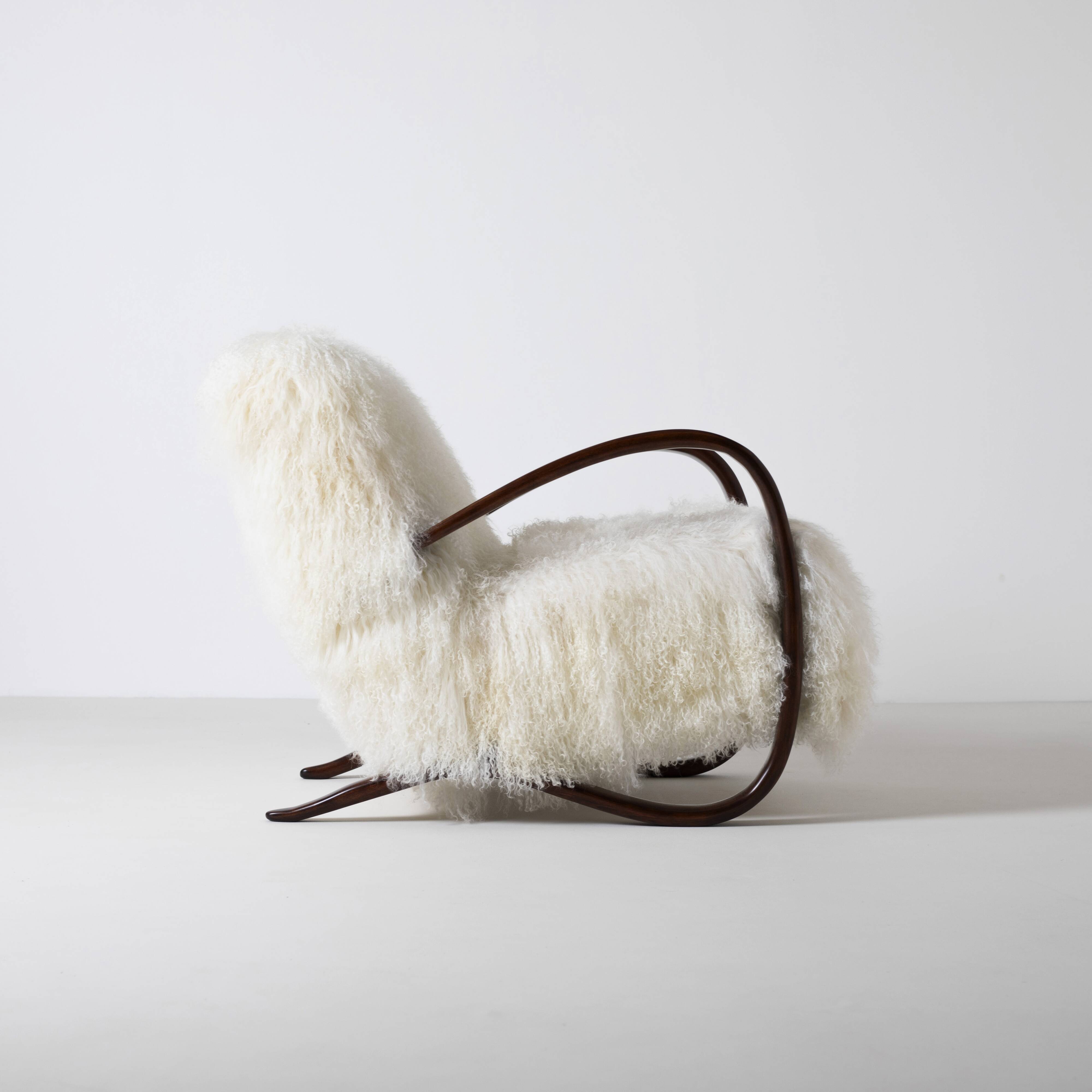 Pair of Jindrich Halabala H 269 lounge chairs in mongolian sheepskin