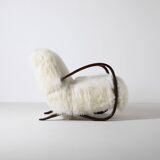 Pair of Jindrich Halabala H 269 lounge chairs in mongolian sheepskin
