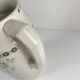 Antique earthenware pitcher, green floral decoration, fine ironstone from the late 19th to early 20th century.