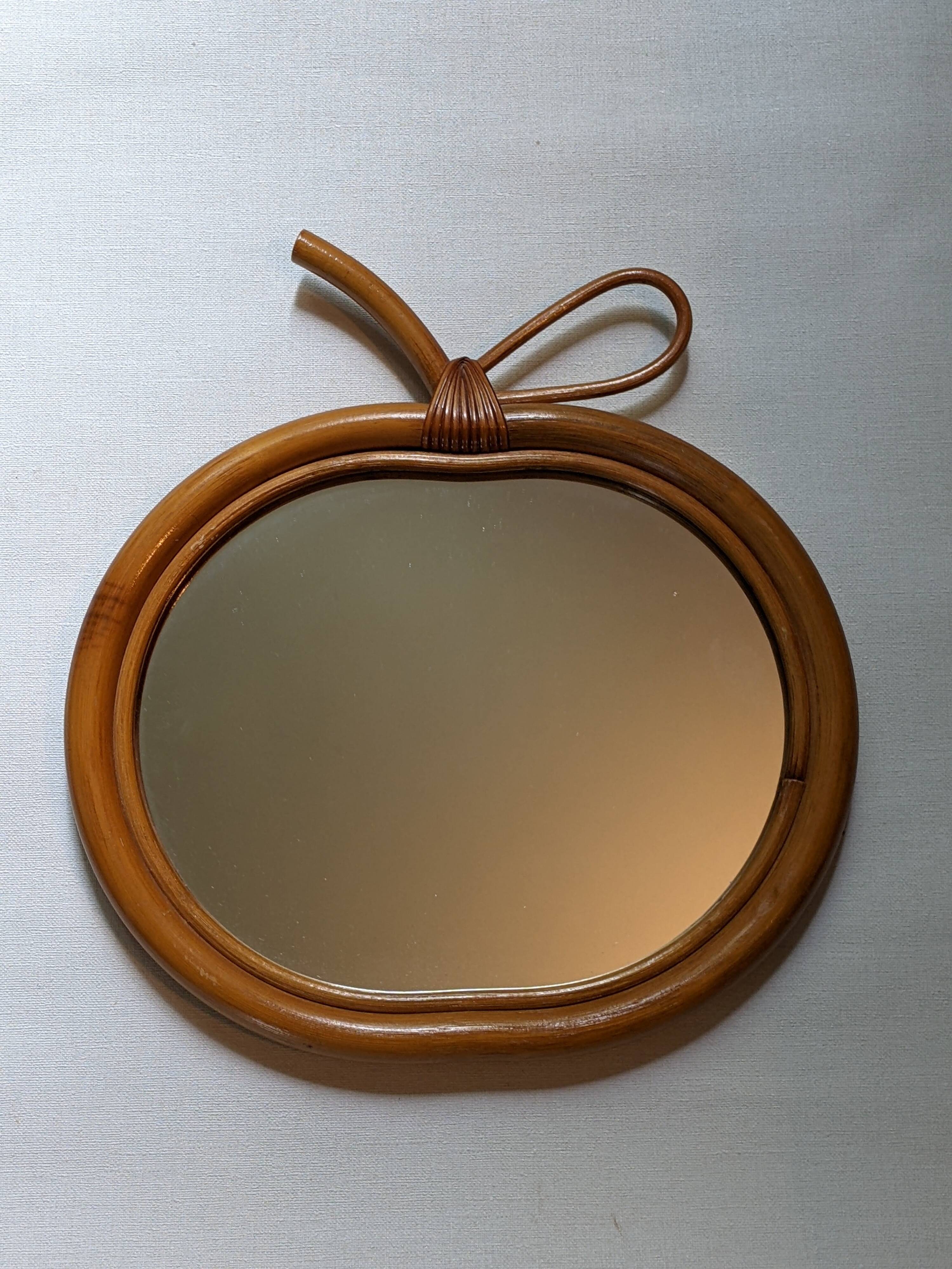 Vintage apple mirror in bamboo rattan from the 70s.
