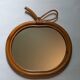 Vintage apple mirror in bamboo rattan from the 70s.