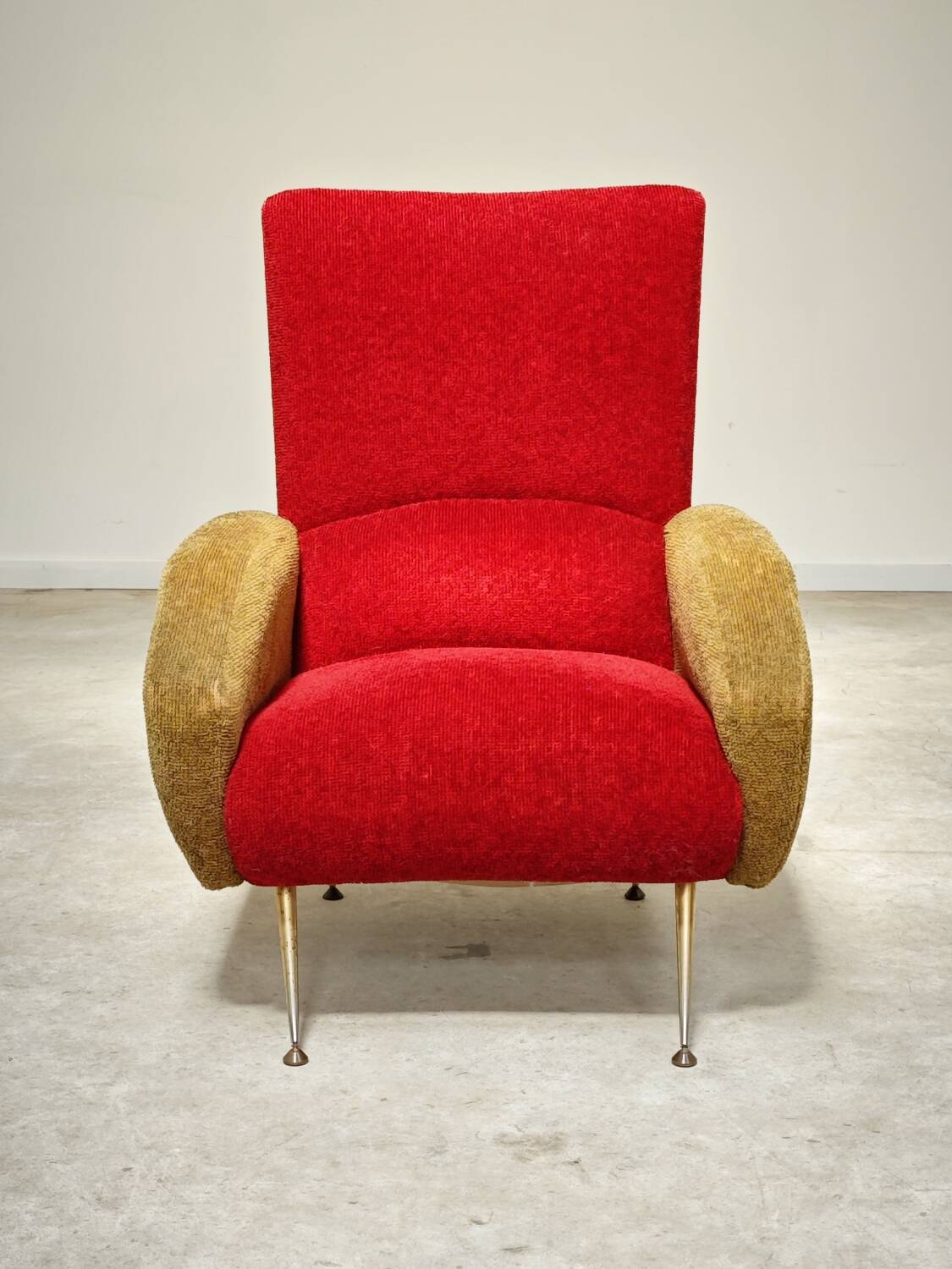 Red and mustard yellow fabric armchair in 1970s style