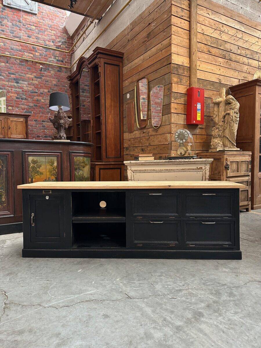 Old workshop furniture transformed into a TV unit.