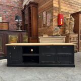 Old workshop furniture transformed into a TV unit.