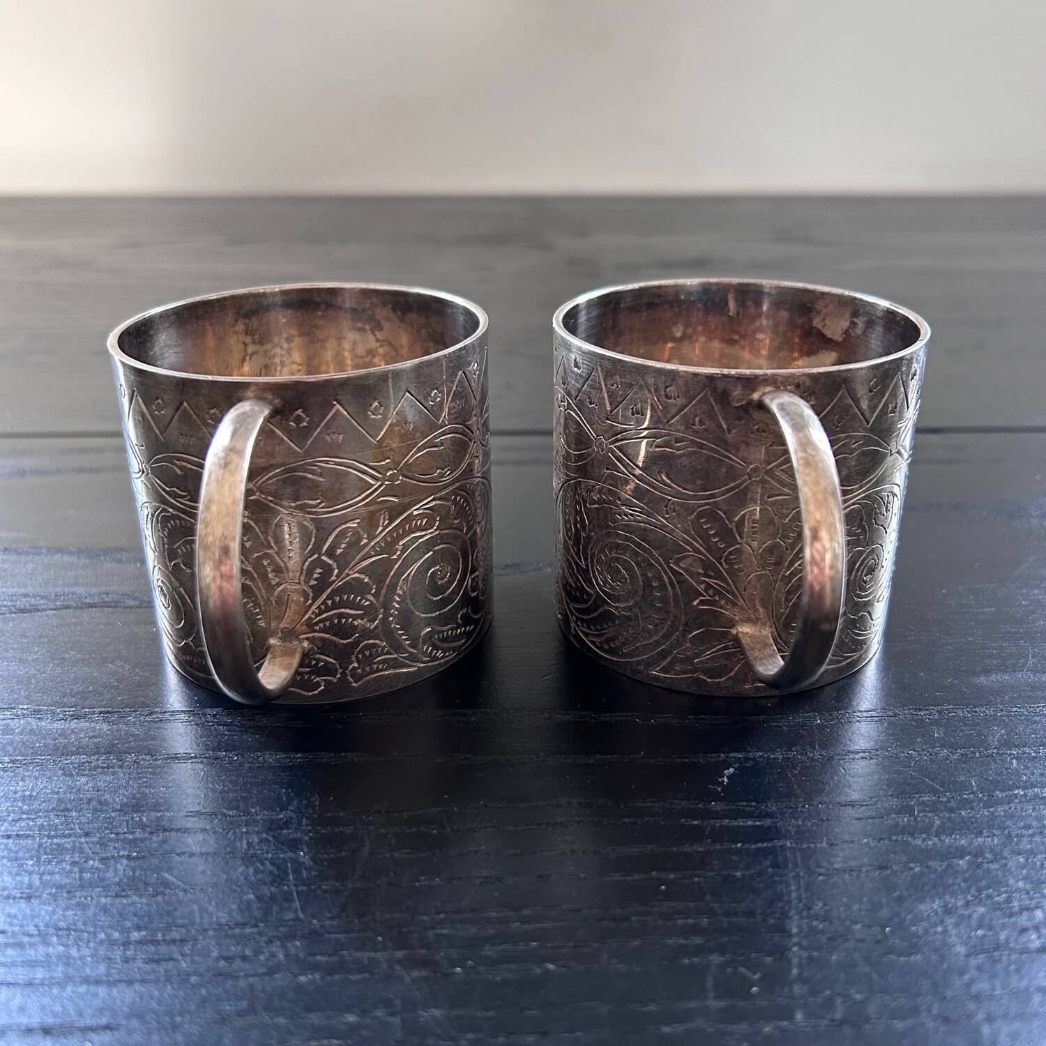 Pair of chiseled silver cups