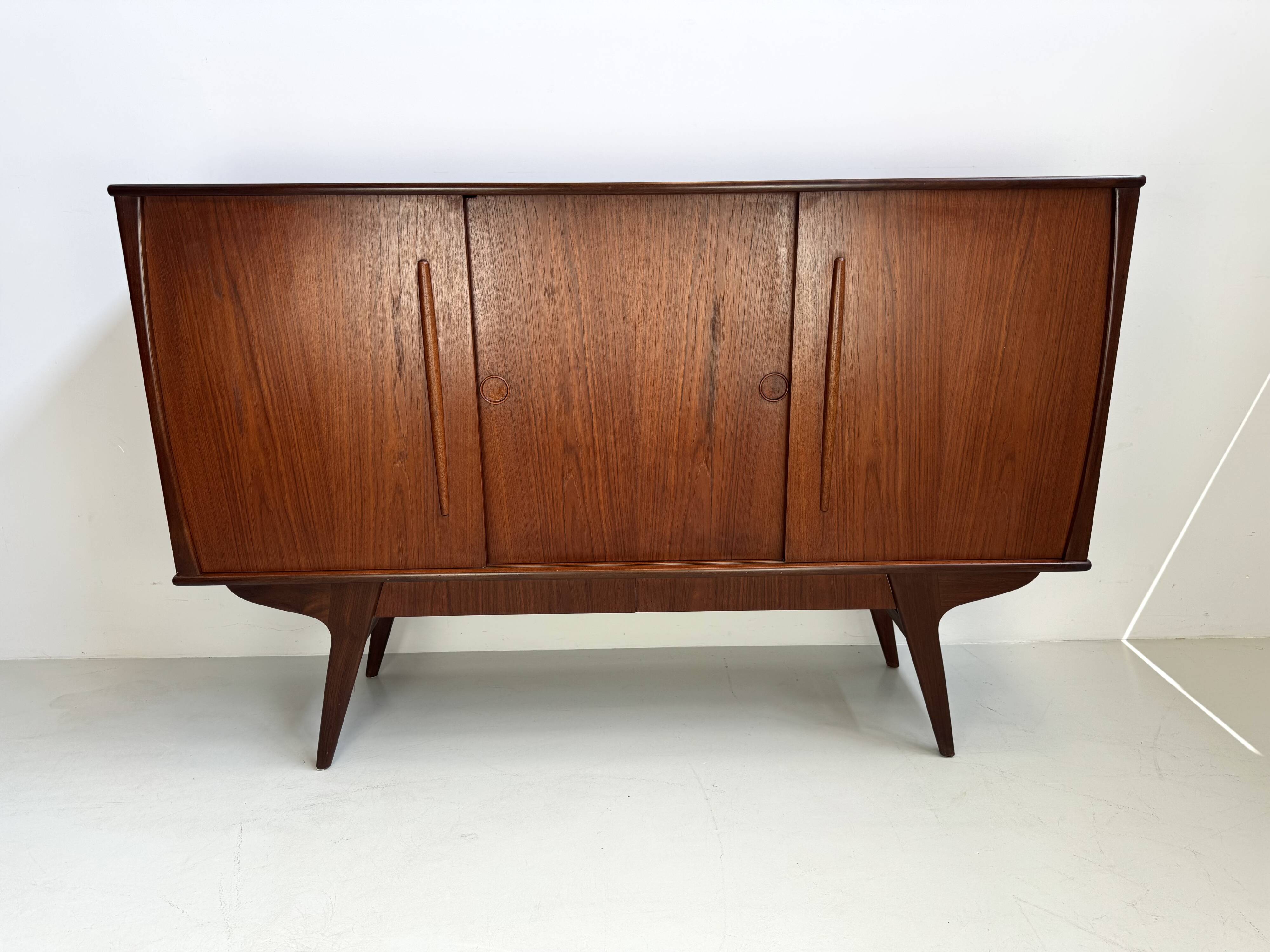 Vintage Danish teak wall unit with sliding doors from the 1960s.