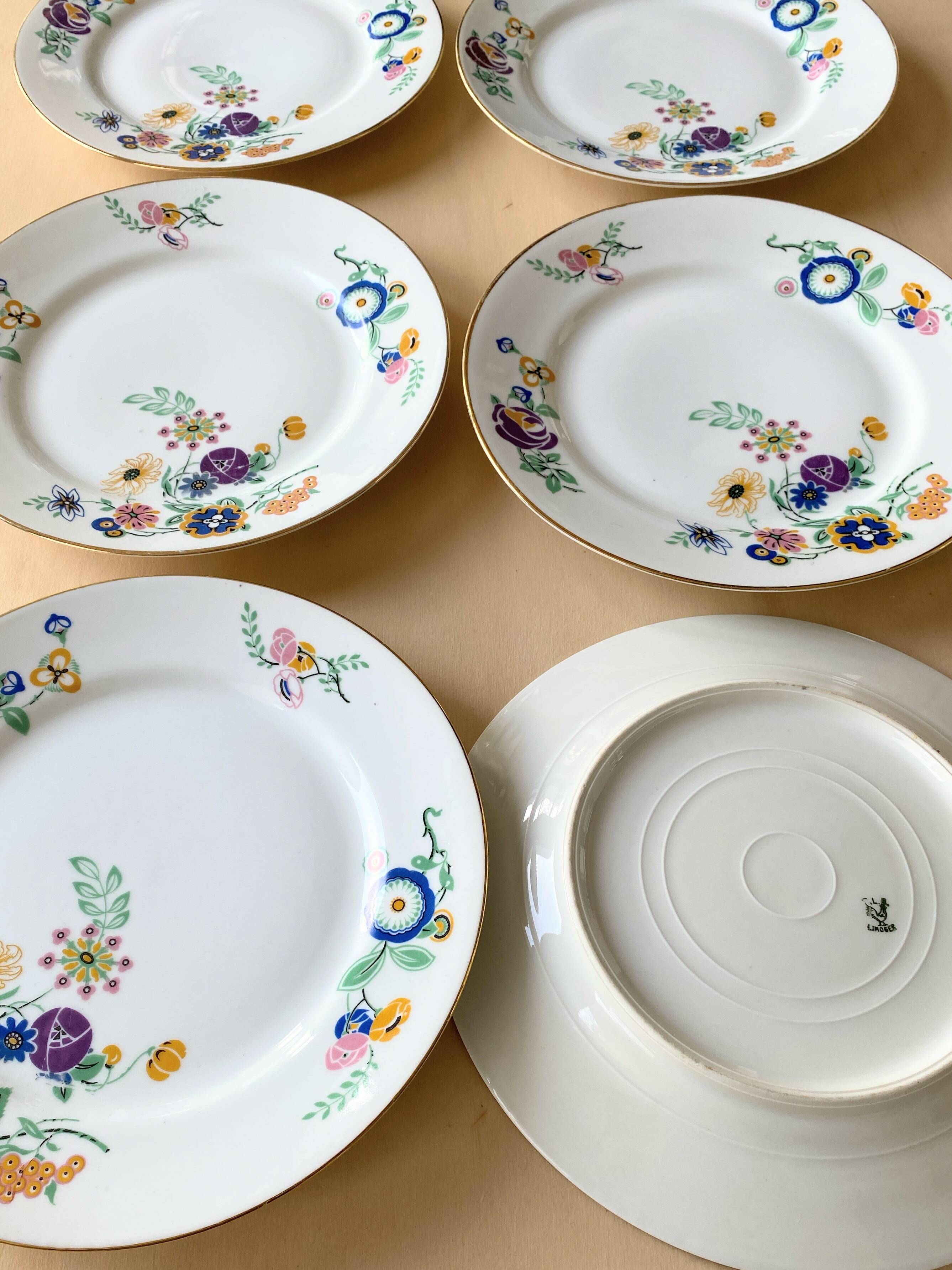 Oval vintage plate in white Limoges porcelain signed T.L.B flowers.