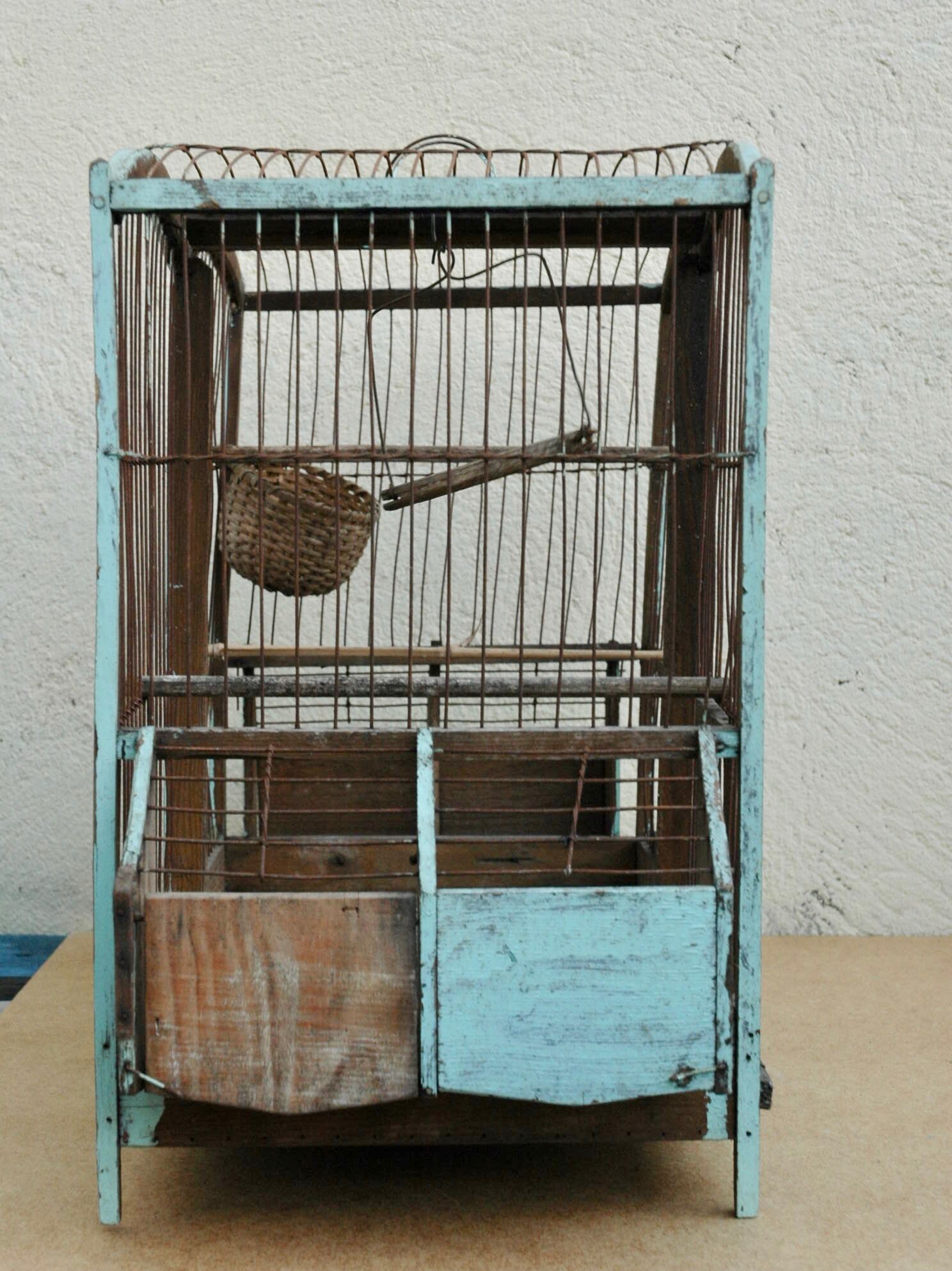 Ancient bird cage in wood and metal