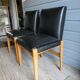 Paire de fauteuils à système en skaï noir, années 50