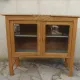 Art Deco sideboard in raw wood with a wax finish, closed by 2 glass doors.