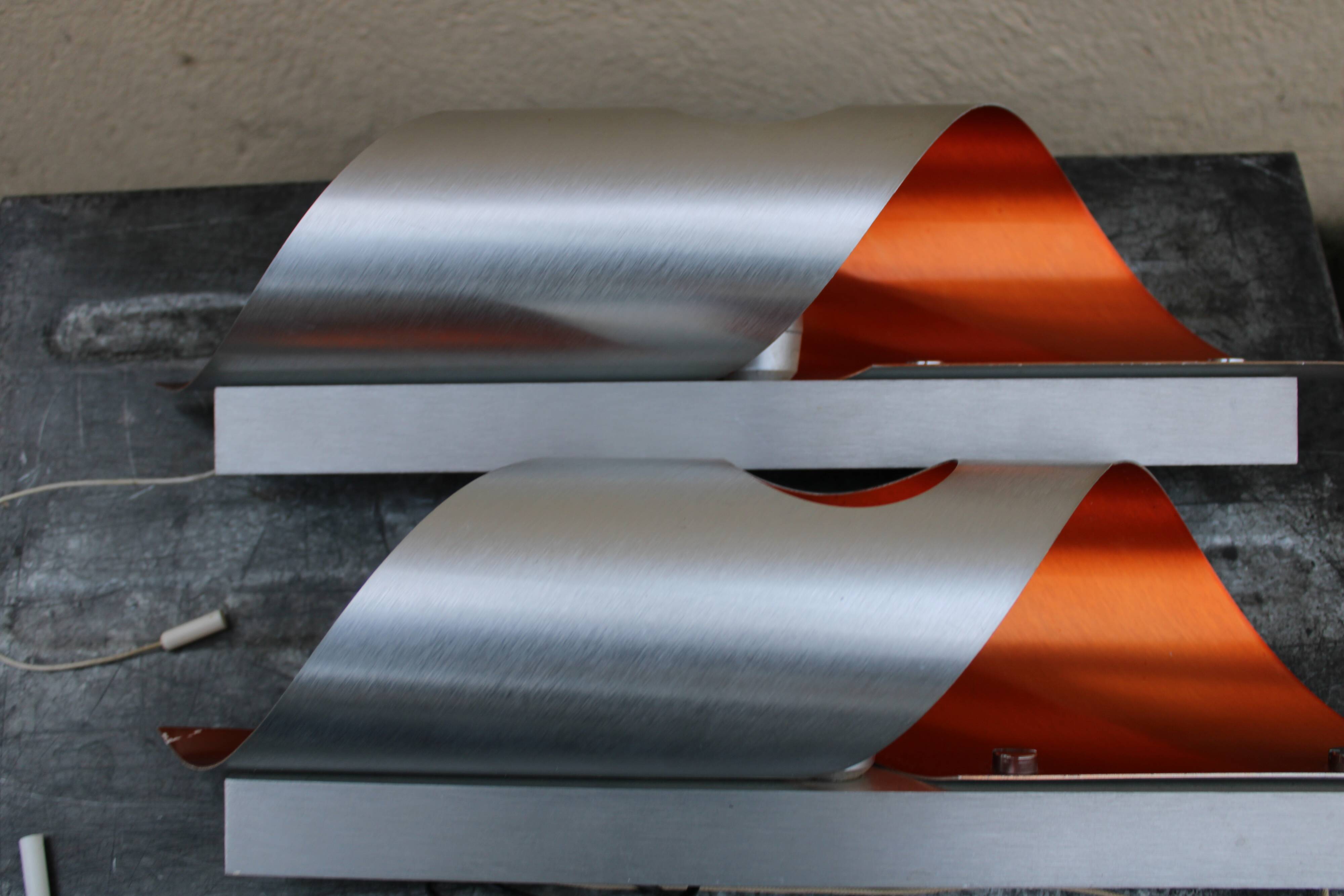 Pair of orange brushed aluminum wall light