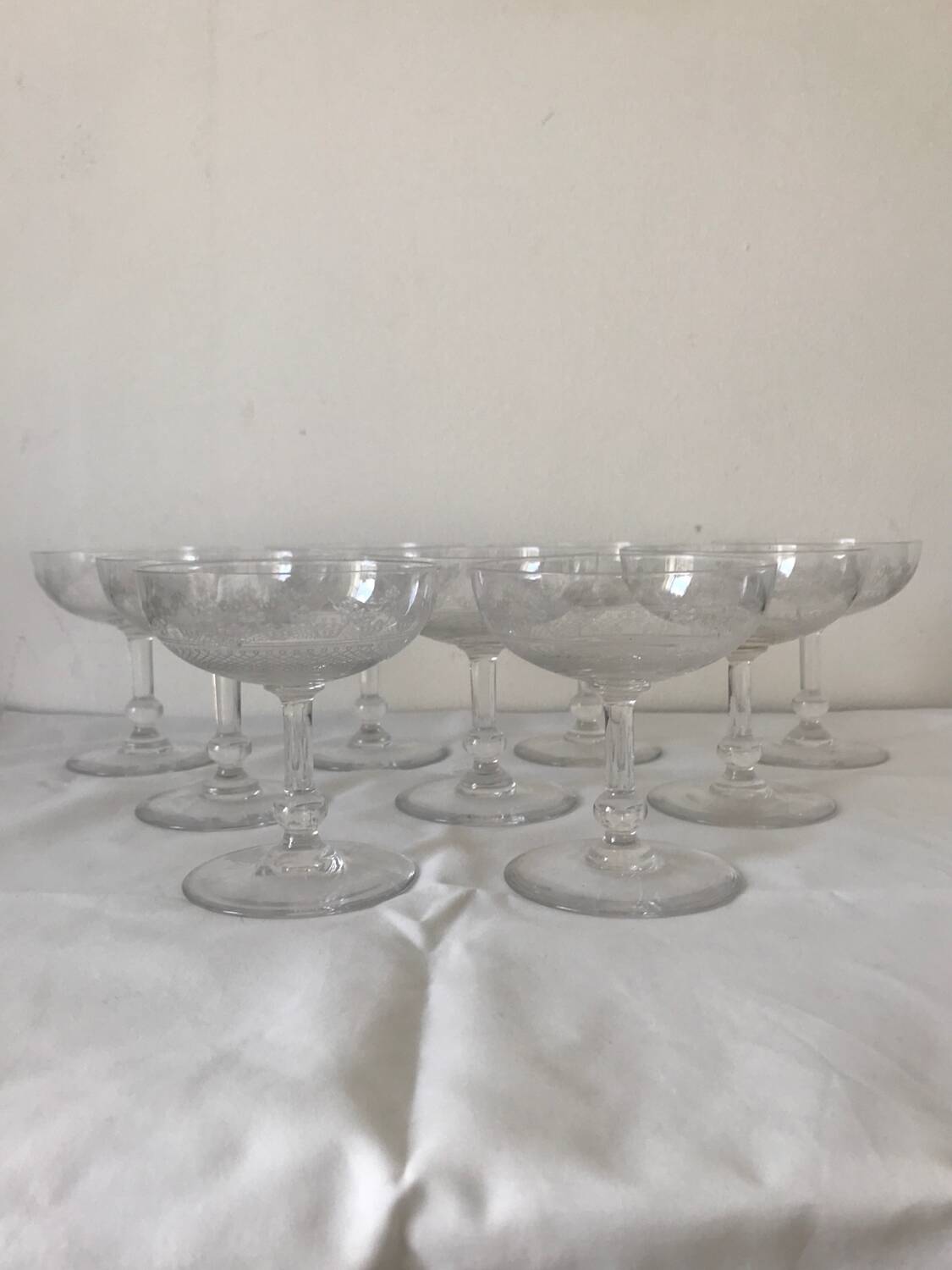 Set of 9 antique champagne glasses in engraved glass