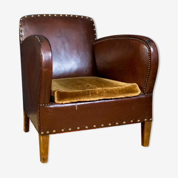 Antique club armchair of leather cloth