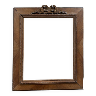 Old wooden frame with knot