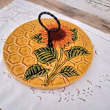 Vintage yellow earthenware cheese dish with sunflower decor and wrought iron handle
