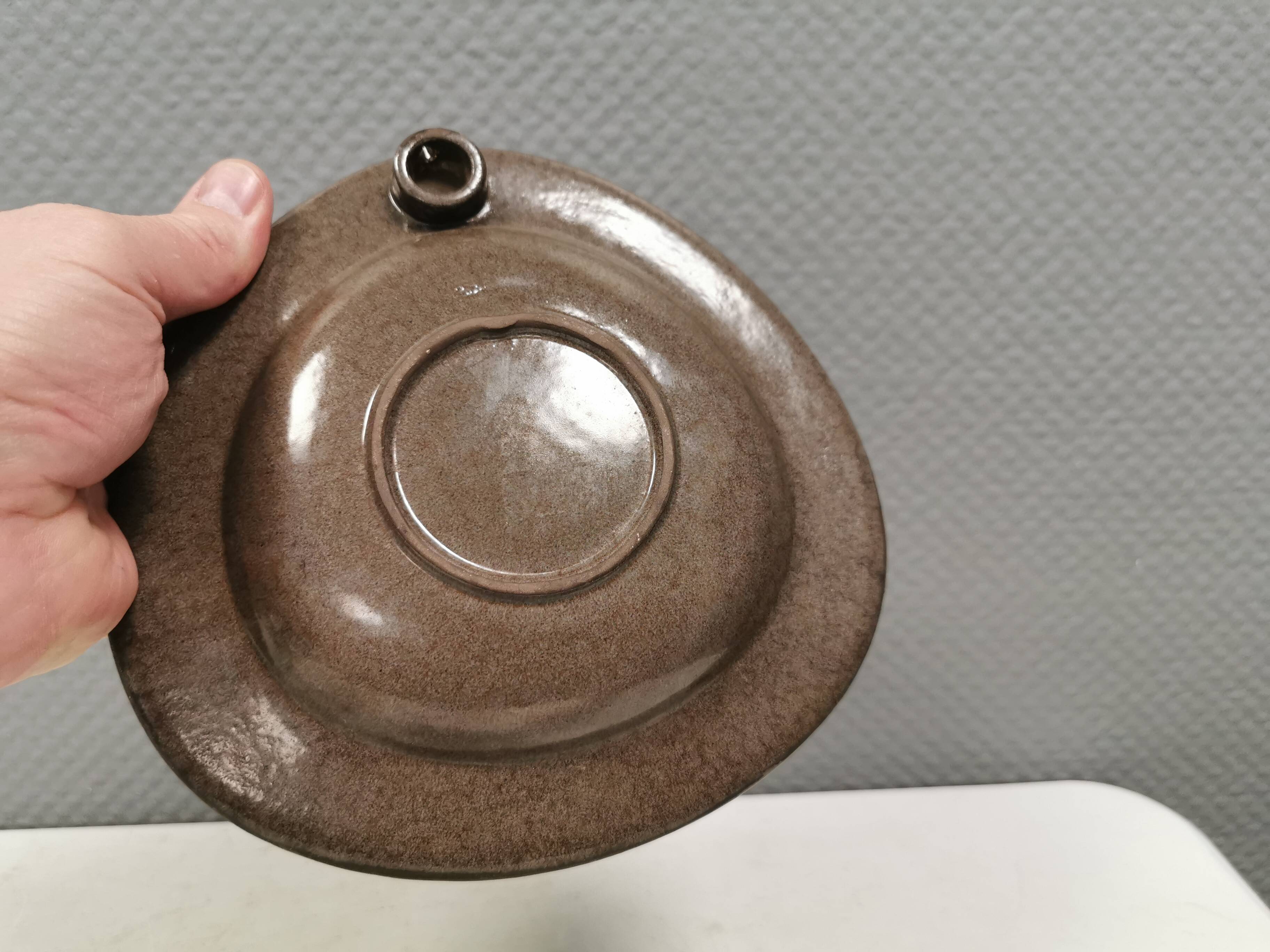 Wall-mounted candlestick in grayish colors, Danish and from the 1970s-80s.