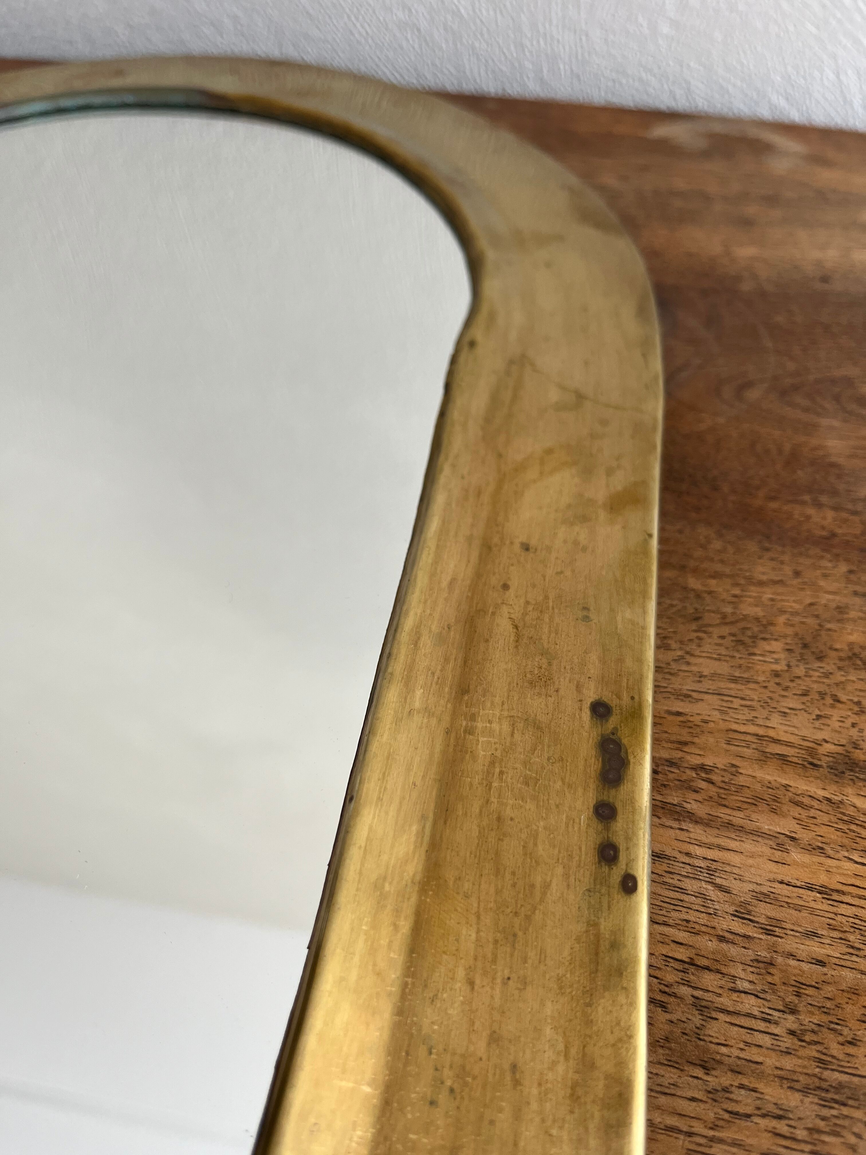 Brass half-moon mirror