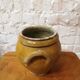 Old yellow glazed terracotta pot