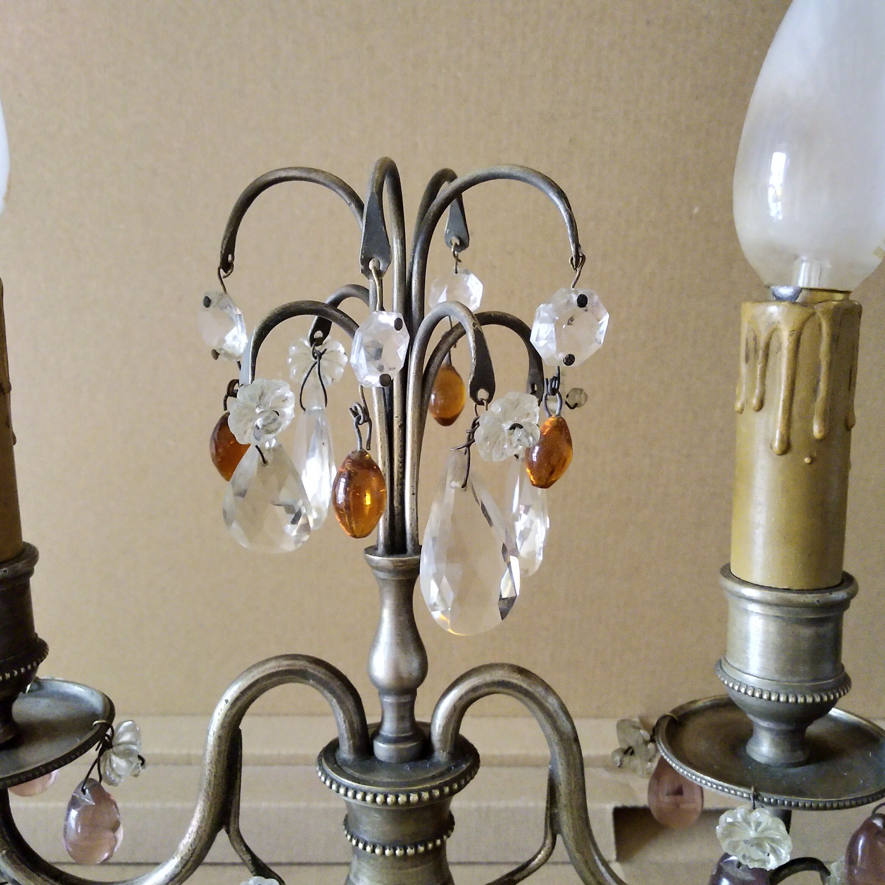 Pair of girandole lamps and silver metal