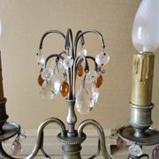 Pair of girandole lamps and silver metal