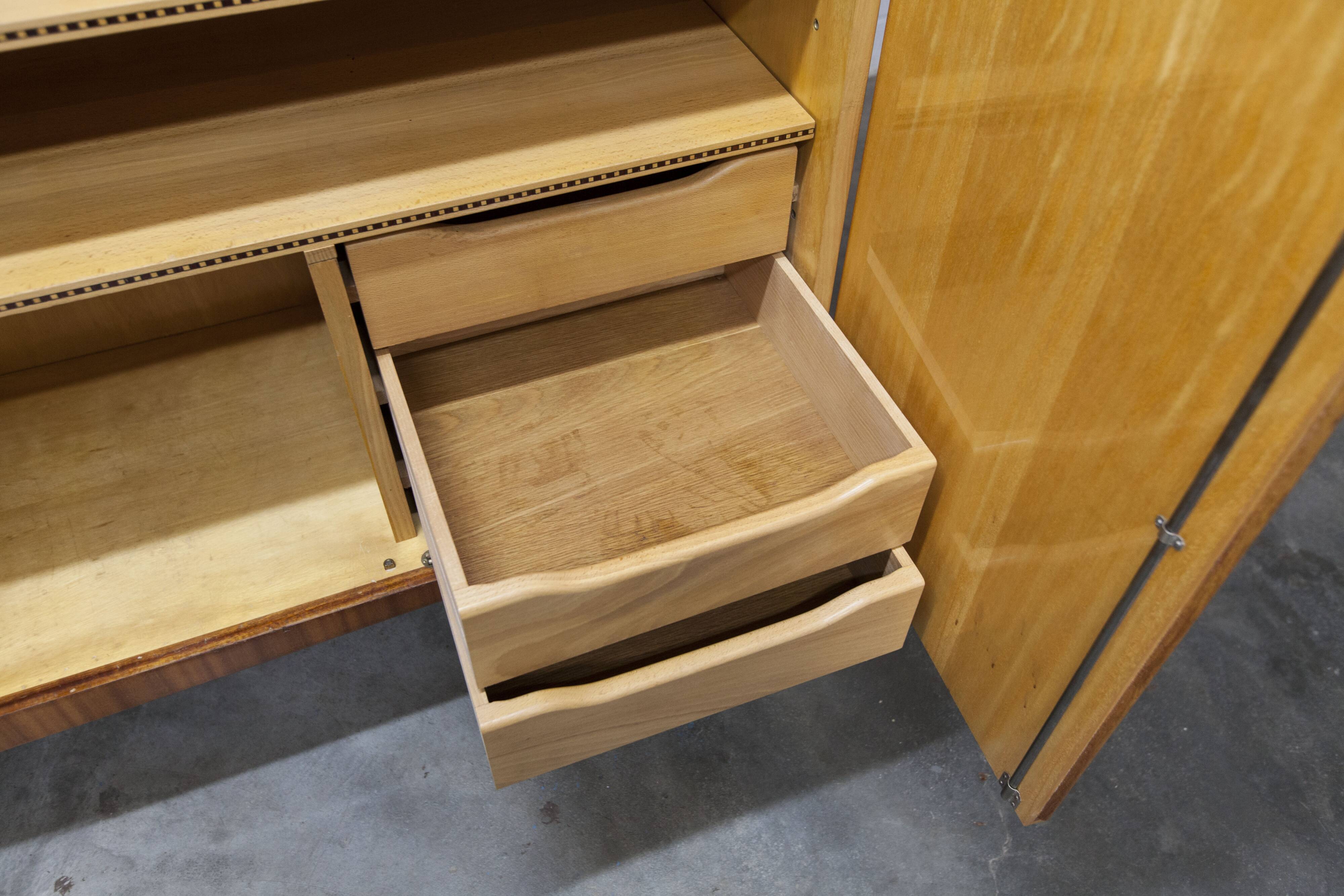 1960s Scandinavian wardrobe, blonde varnished wood, unusual, 4 doors, 3 drawers, 7 shelves.