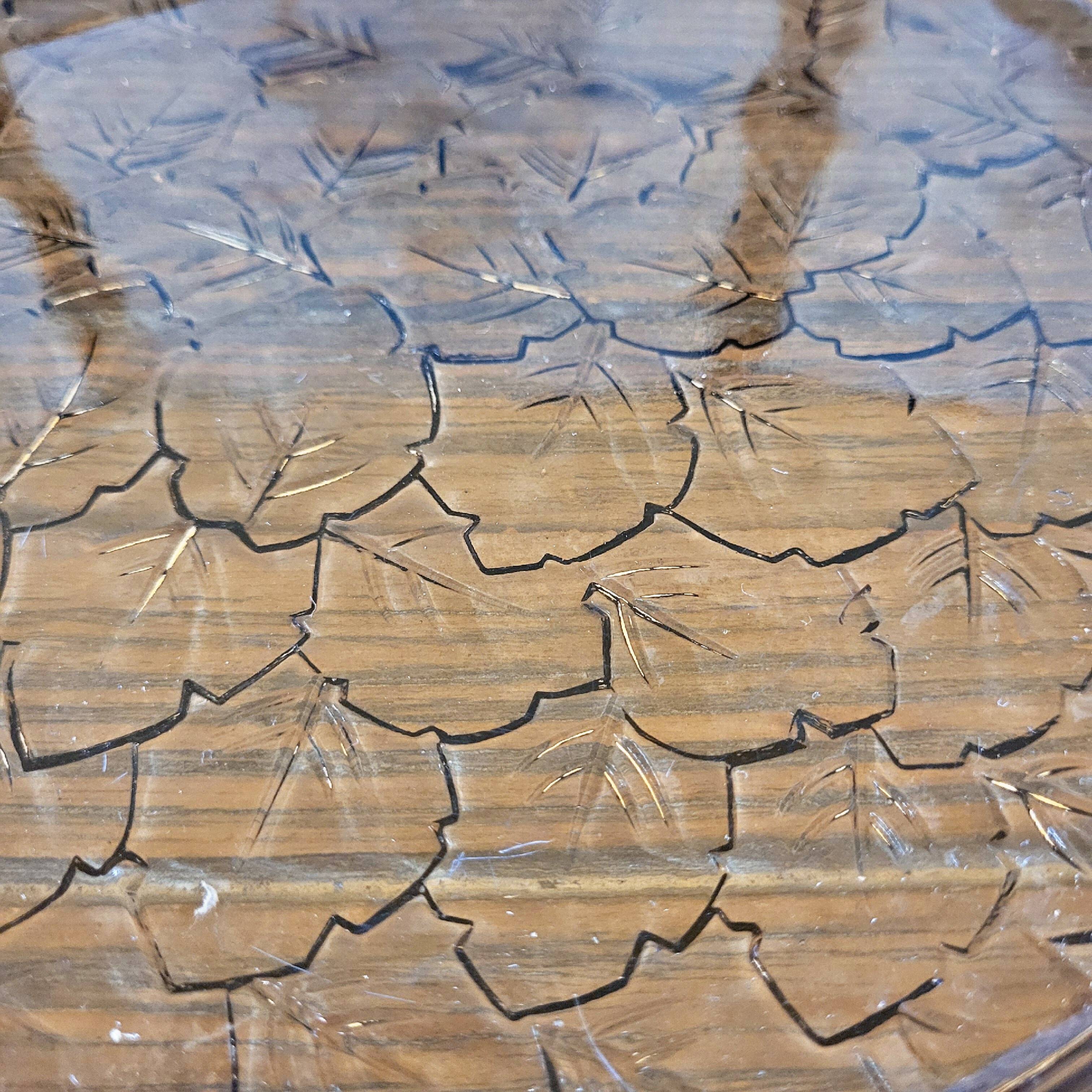 Art deco style black glass tray decorated with leaves