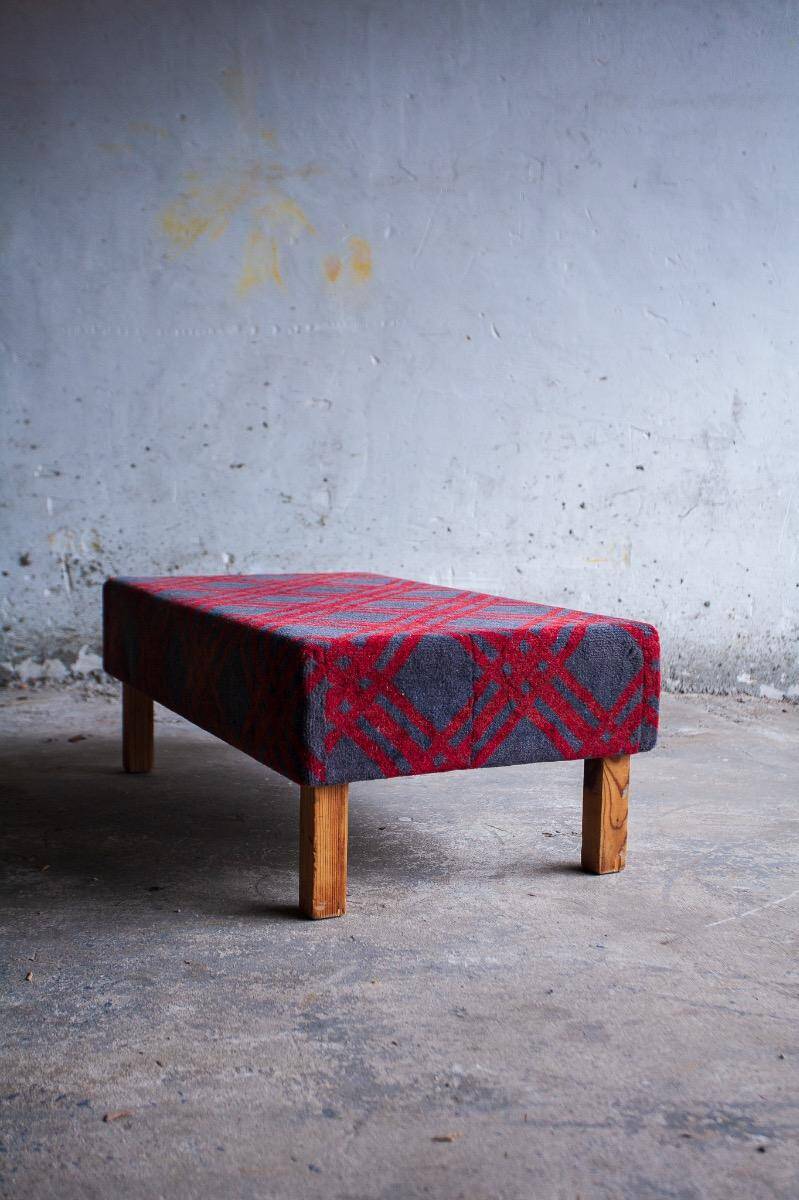 Large red and grey wool tartan upholstered bench with wooden frame