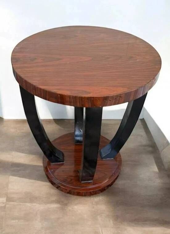 A round Art Deco coffee table made of beech wood and rosewood.