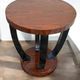 A round Art Deco coffee table made of beech wood and rosewood.