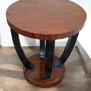 A round Art Deco coffee table made of beech wood and rosewood.