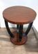 A round Art Deco coffee table made of beech wood and rosewood.