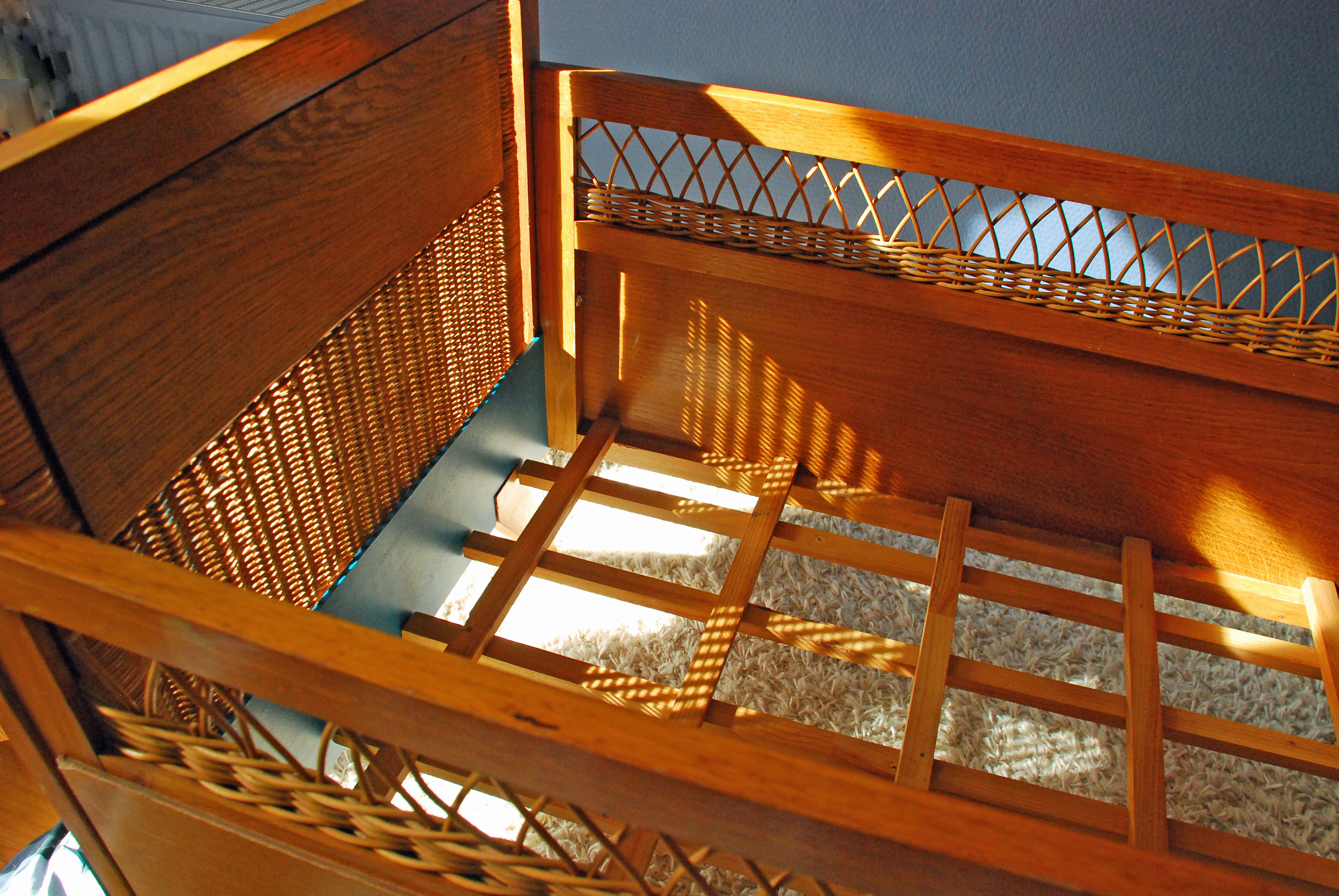 Wooden bed and vintage rattan