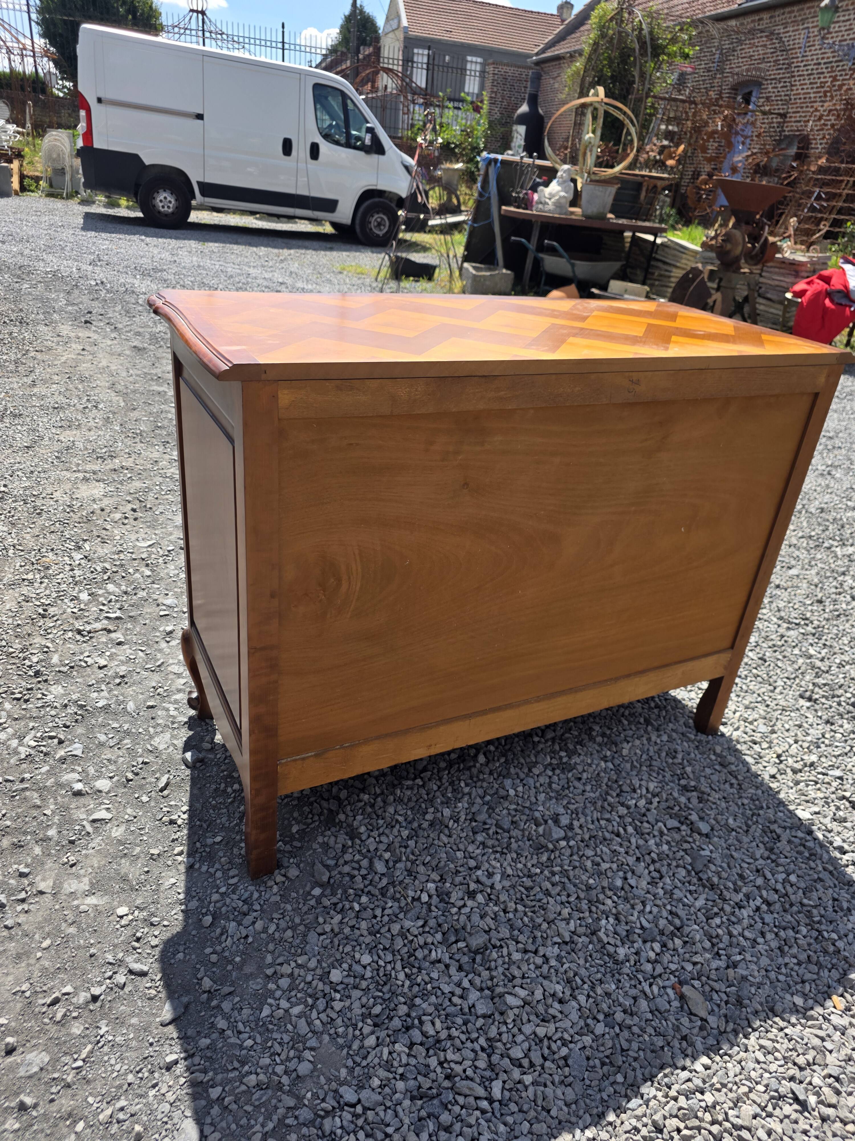 Curved commode in Louis XV style made of cherry wood.