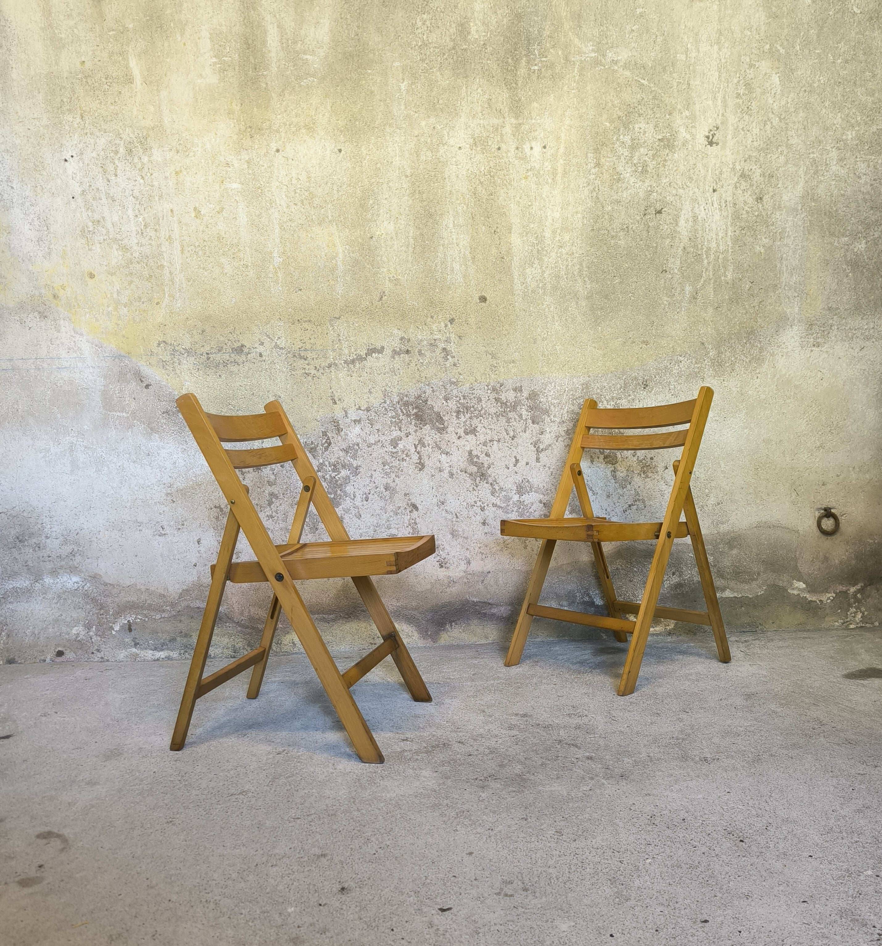 Pair of vintage folding wooden chairs