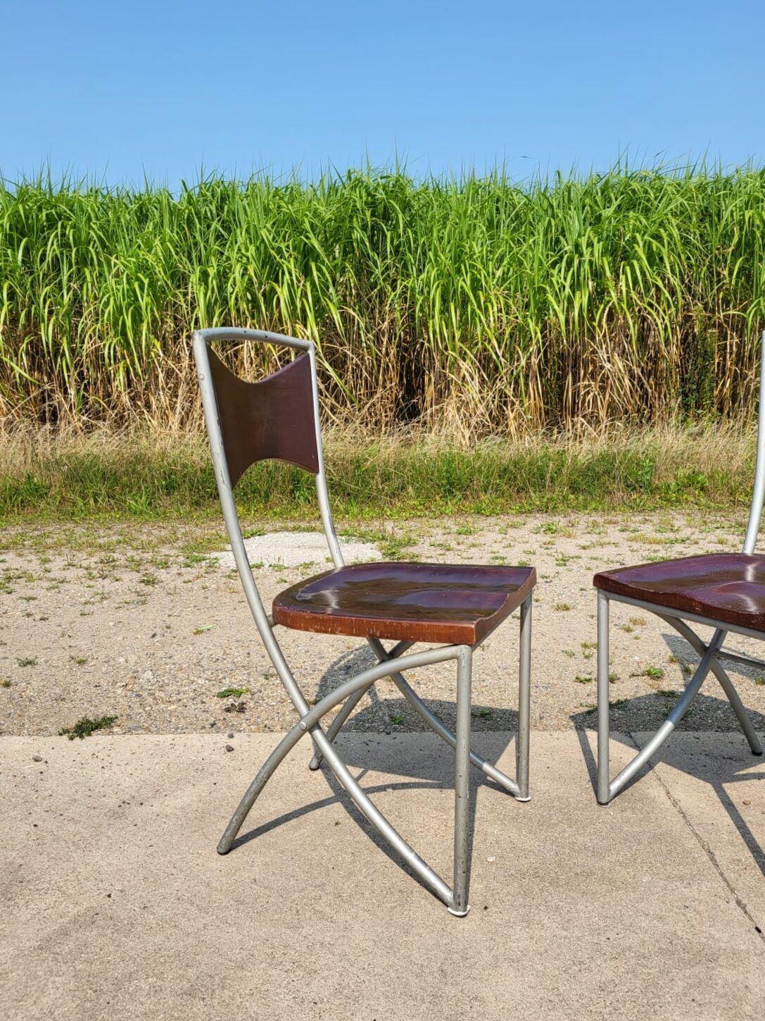 Set of 10 tubular oak bistro dining chairs in vintage industrial style.